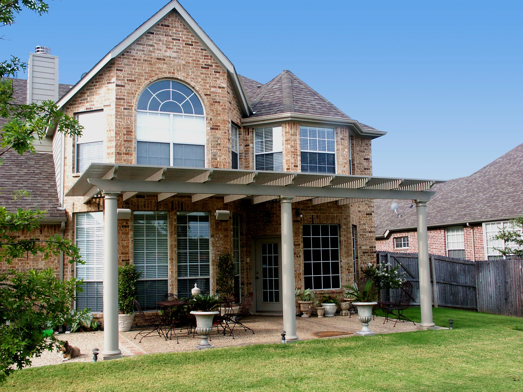 Open-lattice pergola at a two-story home